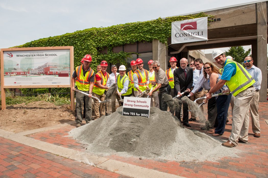 Representatives from the Consigli Construction Co., Inc., Skanska USA Building, Inc. and Symmes, Maini & McKee project team celebrate groundbreaking at Winchester High School Photo by Robert Umenhofer